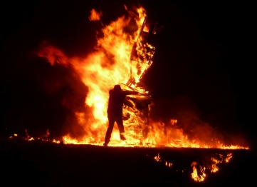 Silhouette of man in flames at Burning of the Clavie