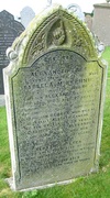 headstone with pointing hand