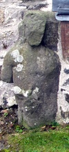 figure next to tomb