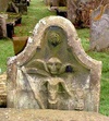 Unusual gravestone, showing a winged archetype of death