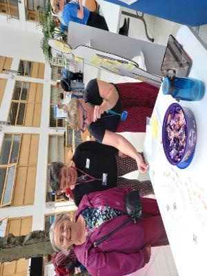 A photo of ACE staff members talking with members of the public on Doors Open Day