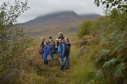 Group standing in front of a mountain