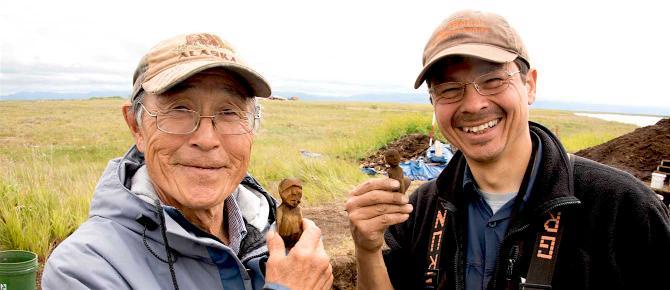 Sven and John at Nunalleq with figurines