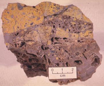 Highly altered brecciated andesite from the basin margin fault zone. The andesite has been altered to quartz and K-feldspar (adularia)