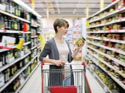 Woman choosing food in supermarket