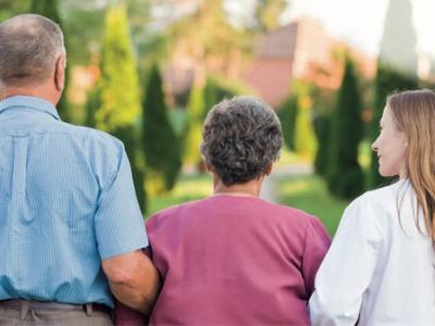 Elderly lady with carer