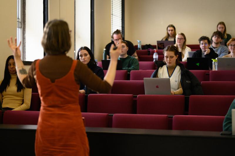 Students listen to a professor in a lecture theatre