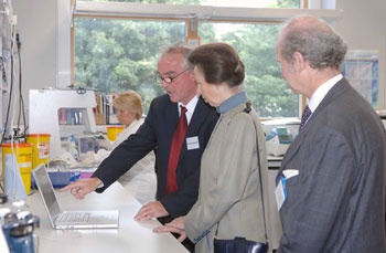 Prof John Forrester explain corneall graft research to Princess Royal watched by Dr David Galloway