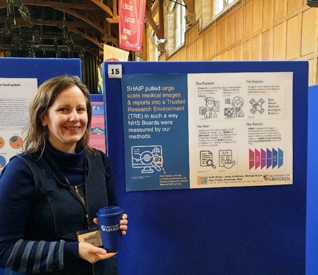 Katie Wilde and her poster for the Interdisciplinary Open Sessions