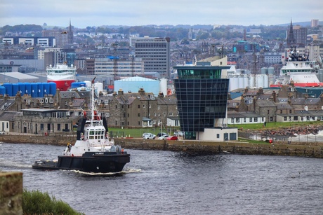 ship in Aberdeen harbour in front of city