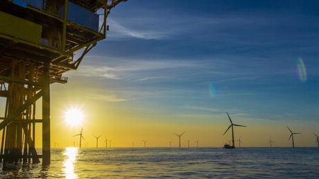 Image of an Offshore Oil Rig and Wind Farm
