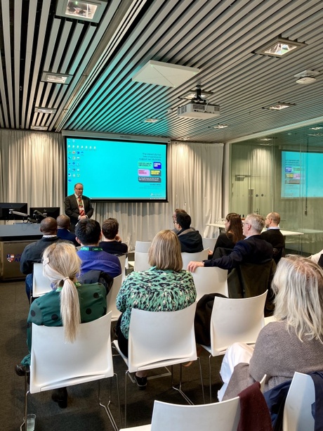 Professor Andrew Steven of the University of Edinburgh presenting at the event in front of seated guests