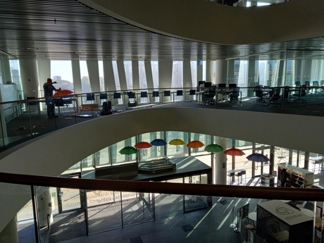 Brightly coloured umbrellas hanging from the atrium