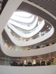 A photo of the inside of the Sir Duncan Rice Library, showing the large central atrium and different floors.