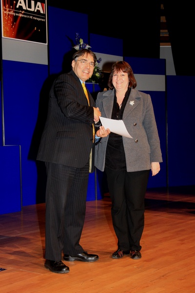 Kathryn Fowler receiving the award from Professor Les Ebdon, chair of University think-tank Million+