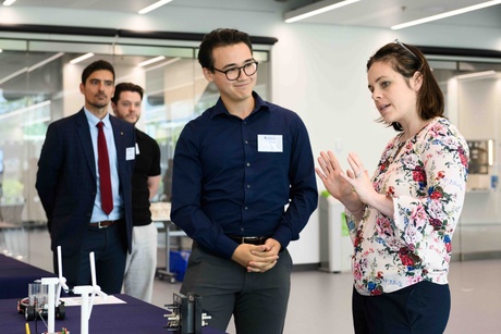 Two people standing and talking