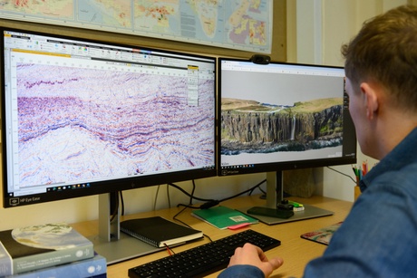A student looking at generic geological information