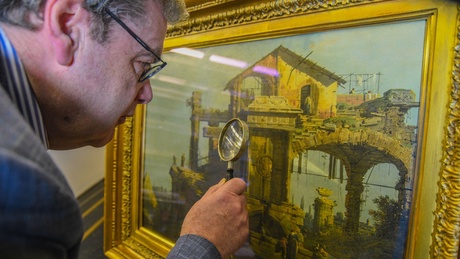 Art Historian John Gash inspects the Canaletto artwork