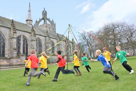 Children from St Peters Primary School try out the Maypole