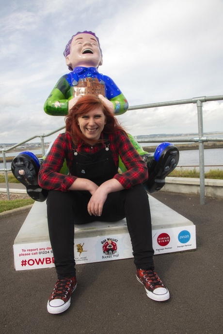 University graphic designer and professional illustrator, Charlie Dear, with her 'Oor Legends' statue - part of Oor Wullie's Big Bucket Trail in Aberdeen