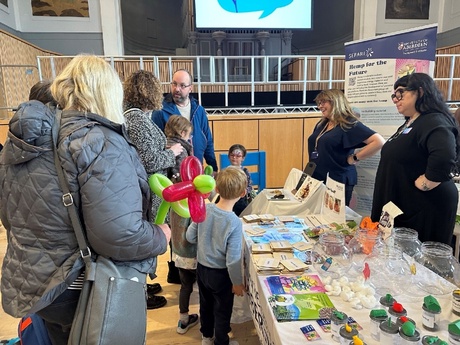 Image shows a family speaking to University staff at Explorathon event