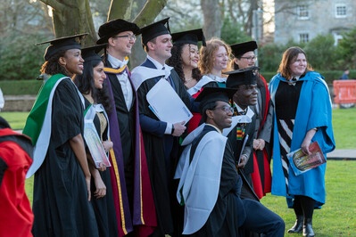 A group of people in robes posing for the camera