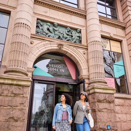 A photograph of people walking out of Aberdeen Art Gallery