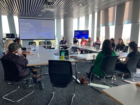 A photograph of a group of people in a meeting held in Sir Duncan Rice Library