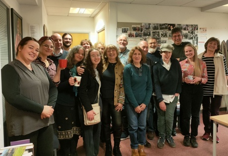 A photograph of the Polish-Scottish Song Group altogether smiling