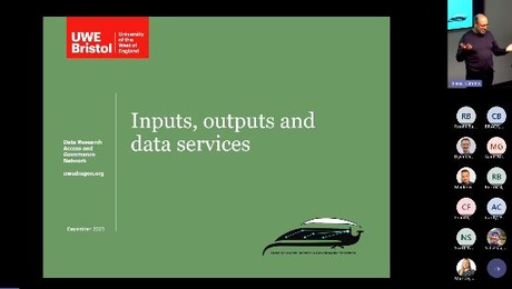 Title slide from seminar with green background and 'Inputs, outputs and data services' in white text. Presenter in the corner.