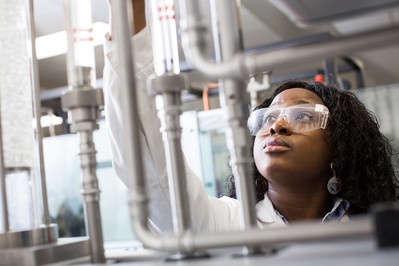 Photo of a student working in an engineering laboratory / workshop