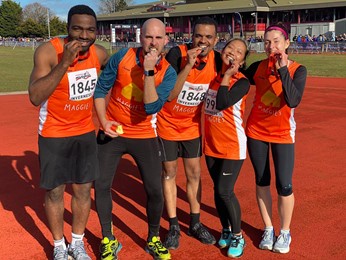 Dental student runners celebrate with their medals in Inverness