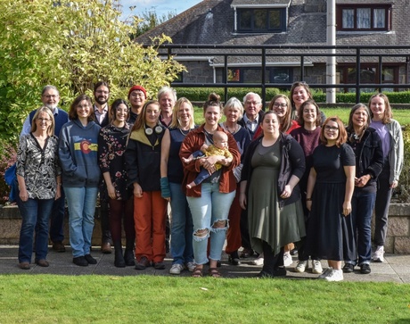 Staff and Students posing for a photo