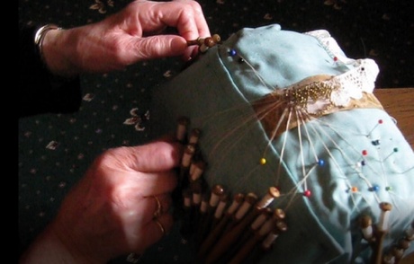 Woman's hands holding onto bobbins