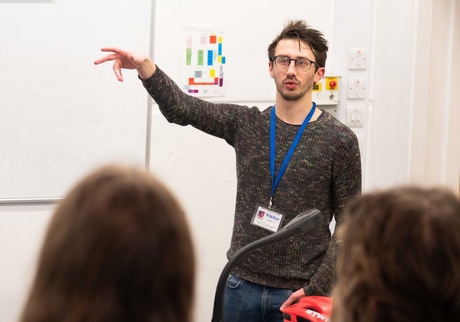 Lecturer standing in front of pupils