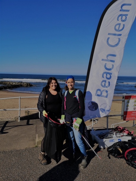 staff participates in beach cleaning