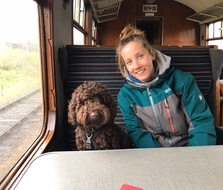 Amber and her dog Ziggy on the train