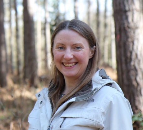 Picture of Kate walking in the forest