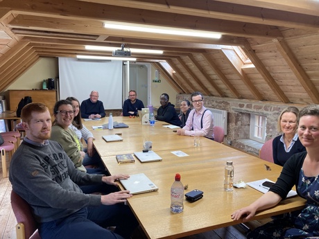 Photograph of 10 Law Academics sitting around round table