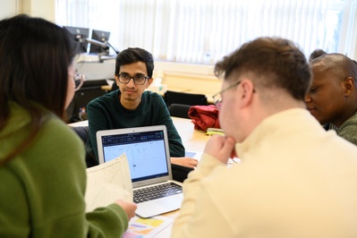 Students sitting around table