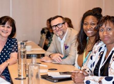 Dr Onyoja Momoh photographed around a table alongside Professor Marilyn Freeman, Mr Justice MacDonald (E & W), Dianne Harrison (Children’s Advocate of Jamaica)