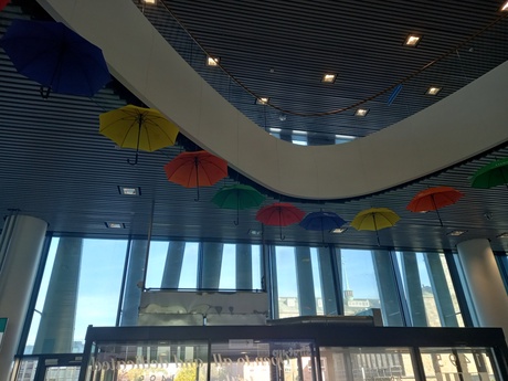 Brightly coloured umbrellas hanging from the ceiling