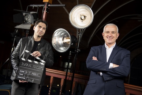 Dr Calum Waddell and Professor Pete Edwards with film set clapperboard and lights