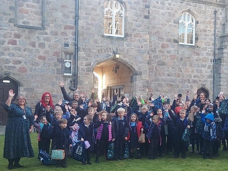 Pam and the pupils outside King's Conference Centre