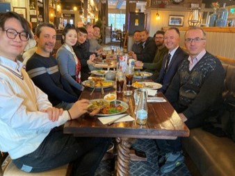 The researchers enjoying a meal together