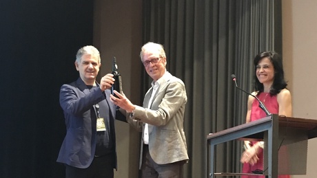 Professor Celso Grebogi (right) receiving the James Yorke Award