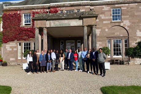 Group shot of the retreat attendees outside The Burn