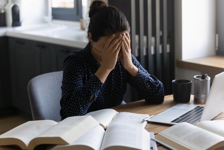 Stressed student studying