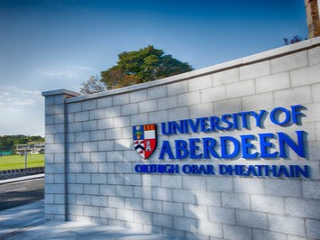 The University name and branding on the entrance at the Old Aberdeen campus