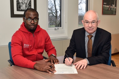 Student President Lawson Ogubie and Principal Professor George Boyne at the signing of the joint initiative